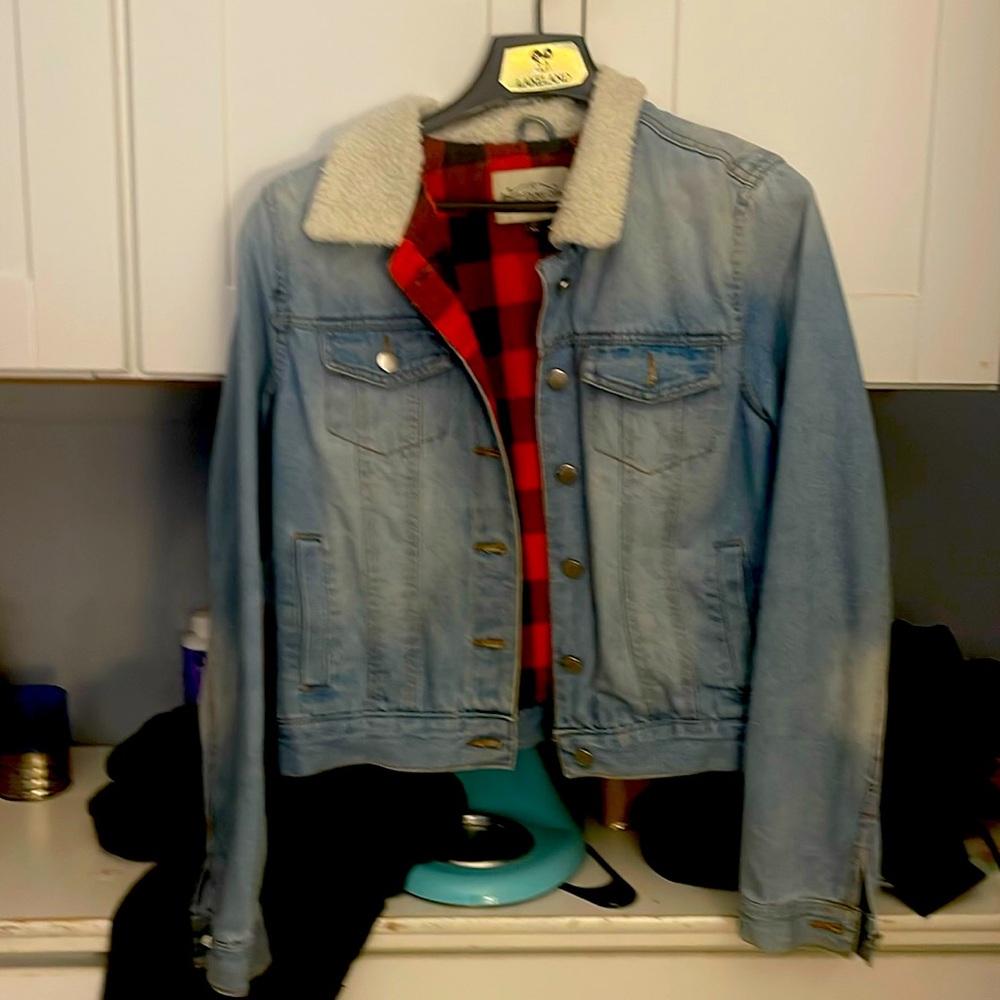 Light blue wash faded like pockets on both sides and a pocket on either side